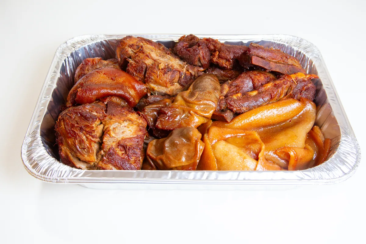 Tray of carnitas, mixed cuts, ready for a catering order