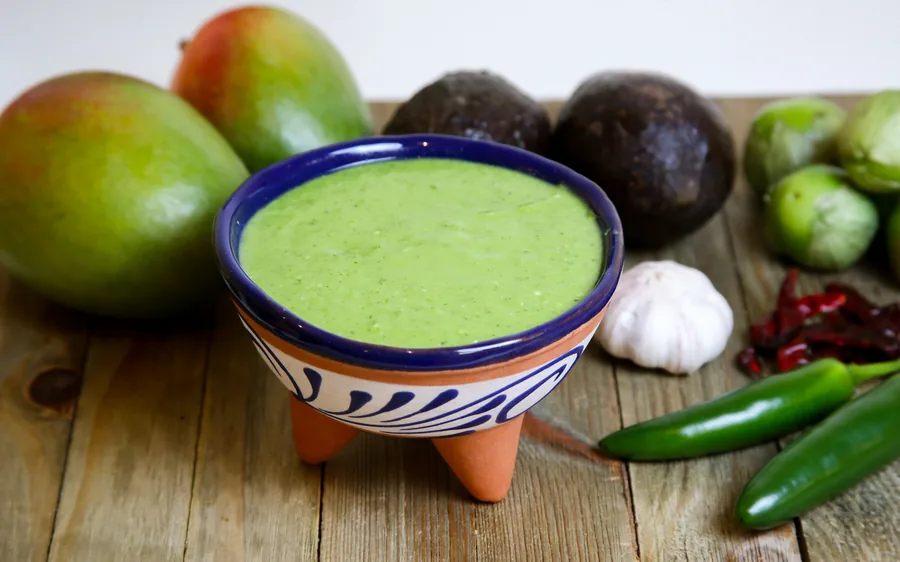 Fresh green salsa served in a traditional bowl